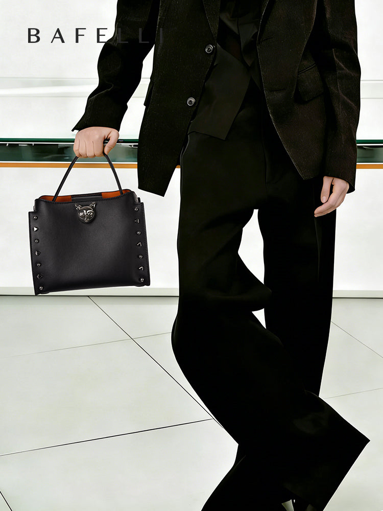 Midnight Black top-grain cowhide leather Shoulder Bag with Chain Strap, perfect for everyday styling — BA-2410P0959-02_08_model_handle-2.jpg