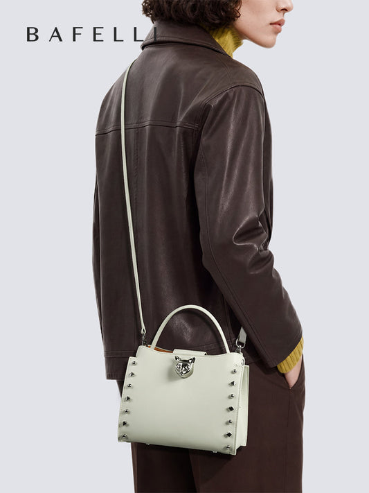 Beige top-grain cowhide leather shoulder bag with a chain strap, perfect for everyday styling — BA-2410P0959-12_09_model_crossbody-2.jpg