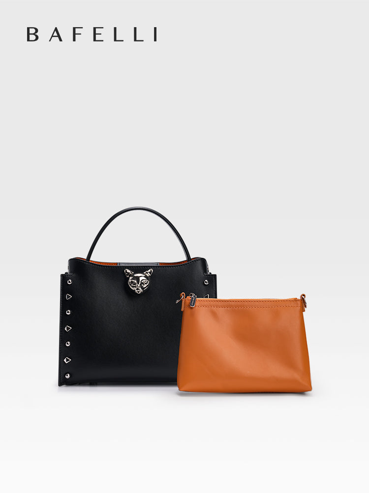 The BAFELLI Midnight Black top-grain cowhide leather women’s handbag features clean lines and a chain shoulder strap, exuding a refined urban aesthetic that’s perfect for everyday styling and city outings.